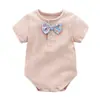 Fabricante de Dongguan Mono de Verano para Bebé de Manga Corta para Niños con Lazos, Ropa Holgada Estilo Bebé de Colores Caramelo