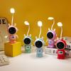 Portalápices multifuncional lámpara de escritorio creativa carga USB plegable luz nocturna de astronauta dormitorio de estudiante aprendizaje luz de lectura