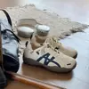 Populares zapatillas de entrenamiento alemanas retro de suela gruesa para mujer, nuevo modelo versátil casual cómodo de otoño 2026 con suelas suaves, zapatos blancos
