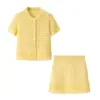 Atacado Fábrica de Roupas Femininas Transfronteiriça 2026 AliExpress INS Conjunto de Jaqueta de Tricô Manga Curta com Franjas + Minissaia de Cintura Alta