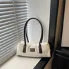 Bolso de Hombro Retro de Nicho Francés para Mujer 2026 Otoño Nuevo Bolso de Bowling Simple de Moda Portátil para el Viaje Diario