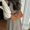 Bolso Femenino para Axila 2026 Nuevo de Moda Primavera/Verano Texturizado de Moda Bolso de Hombro para Viaje Diario Bolso Cruzado tipo Cubo