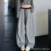 Calça de moletom feminina cinza estilo americano, nova coleção outono 2026, corte solto e relaxado, cintura alta, com cordão, calça de perna larga estilo paraquedas
