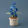 Decoración creativa de planta verde de lana artificial para escritorio de sala de estar en casa, planta en maceta de lana de nomeolvides de 10 cabezas tejida a crochet, transfronterizo