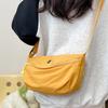 Bolsa Cross-border Niche Canvas Bolsa pequena feminina 2025 Nova bolsa feminina estilo coreano Bolsa crossbody Bolsa de ombro da moda Bolsa de bolinho