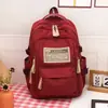 Mochila de Grande Capacidade Transfronteiriça 2024 Nova Simples Letra Mochila Escolar para Aluno do Ensino Fundamental Mochila de Viagem Leve da Moda