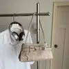 Bolso Pequeño Bajo el Brazo Estilo Chica Picante Retro para Mujer 2026 Nuevo Bolso de Mano para el Trabajo Bolso Baguette Bolso de Hombro con Textura de Otoño