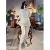 Nuevo Traje de Lino Estilo Nacional Chino Verano Botón de Rana Manga Corta Holgado Top con Abertura Pantalones Casuales de Nueve Puntos Conjunto de Dos Piezas