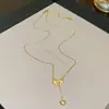 Versión coreana del nuevo y versátil exquisito collar de acero de titanio con lazo para mujer, lujo ligero, alto sentido, borla, amor, cadena para clavícula, venta al por mayor