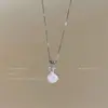 ¡Di con la pepita de oro! Collar de concha con lazo rosa para mujer, diseño de nicho, dulce cadena para la clavícula, accesorio pequeño y exquisito