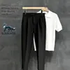 Diseño de nicho de alta gama, pantalones de hombre lisos y sin arrugas, pantalones de traje casual ajustados de color liso retro para verano, modernos
