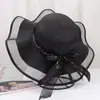 Nuevo Sombrero de Paja para Mujer Verano Viaje Sombrilla Sombrero Playa Mar Protector Solar Sombrero Estilo Coreano Ala Ancha Moño Anti-UV