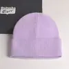 2022 nuevo gorro de punto con volantes de color liso para mujer, gorro de invierno de otoño e invierno, gorro de lana cálido de comercio exterior, combina con todo