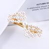 Acessórios de cabelo de celebridade da internet estilo coreano para mulheres Grampo de cabelo com laço de pérola e strass Clipe lateral de cisne para franja Clipe de mola de metal com diamante colorido