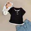 Camiseta estilosa com design patchwork de seda de amoreira e lã, com aparência de duas peças, de manga curta, em uma cor abóbora que valoriza o corpo, top casual de verão com gola redonda