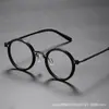 Antitormenta negra con montura de gafas de moda retro para hombre, montura redonda, estilo punk, metal, luz anti-azul, espejo plano al por mayor