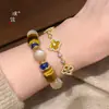 El Mismo Estilo que el Pulsera de Ojo de Tigre con Forma de Trébol de Cuatro Hojas Chapada en Oro y Incrustada con Diamantes de la Tienda de Oro Puzuo para Mujer, Lujo Ligero, Sensación de Alta Gama, Joyería Versátil y Apilable