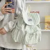 Mochila a rayas de alta moda al por mayor para estudiantes universitarias, adecuada para ir al trabajo y uso casual, mochila pequeña para actividades al aire libre, fresca y elegante