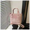 Bolso tipo cubo de alta moda estilo coreano para mujer, nuevo modelo 2026, bolso de mano simple y elegante, bandolera y bolso de hombro casual moderno para el día a día.