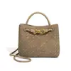 Nueva bolsa tejida para mujer transfronteriza en stock, bolso versátil para ir al trabajo, bolso de hombro y cruzado, bolso texturizado