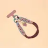Correa de muñeca para teléfono tejida a mano creativa, llavero girly colorido estilo caramelo, accesorio portátil desmontable