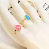 Suministro transfronterizo de anillo abierto de circonita de forma geométrica de gota de aceite multicolor para mujer, cobre chapado en oro de 18 quilates, anillo de personalidad europeo y americano