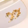 Acero de titanio con baño de oro real, pendientes de acero inoxidable transfronterizos, impermeables y que no se decoloran, pendientes de acero de titanio con goteo de aceite, ventas directas de fábrica