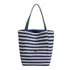 Nueva bolsa de lona de doble cara a rayas de bloques de color más vendida transfronteriza, gran capacidad, adecuada para ir al trabajo y uso casual, bolso de hombro para mujer