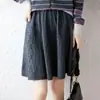 Nueva falda corta de punto de lana pura para otoño e invierno para mujer, color liso, adelgazante, de cintura alta, línea A