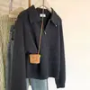 Nuevo estilo de primavera moda femenina versión coreana simple versátil top de punto de lana color liso con cuello camisero y media cremallera