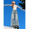 Chao Li tiene en stock jeans con diseño bordado de patrón de dibujos animados para mujer, nuevo estilo de otoño, holgados, adelgazantes, de pierna ancha, de largo hasta el suelo.