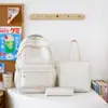 Mochila casual de color sólido simple multicapa de comercio exterior nuevo conjunto de tres piezas para estudiantes de primaria y secundaria