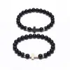 Pulseira de contas de vidro transfronteiriça bola de vidro fosco pulseira de corda elástica trançada pulseira de casal cruz preta e branca personalização