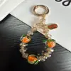 Cadena única para teléfono móvil con cuentas de caqui de cristal, correa colgante con amuleto de caqui estilo vintage artístico