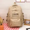 Mochila de Grande Capacidade Transfronteiriça 2024 Nova Simples Letra Mochila Escolar para Aluno do Ensino Fundamental Mochila de Viagem Leve da Moda