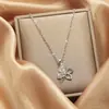 Collar de acero de titanio de moda europea y americana para mujer, colgante rosa galvanizado de oro auténtico, cadena de clavícula elegante de celebridades de Internet, joyería sencilla