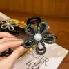 Novo elástico de cabelo flor com strass da moda, presilha de garra para cabelo fashion, acessório de cabelo para mulheres, prendedor de coque versátil e estiloso