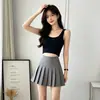 Saia plissada branca de cintura alta com shorts de segurança embutidos para evitar exposição, saia curta versátil em estilo preppy, disponível para atacado