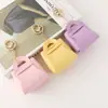 Nuevo Monedero Creativo Color Caramelo Llavero de Auriculares Moda Femenina Bolso de Almacenamiento de Cuero Versátil Colgante Regalo