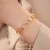 Pulsera ovalada de circonita chapada en oro real de 18k, sensación de lujo ligero de alta gama, joyería de diseño de nicho simple y elegante
