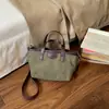 2026 Nova Tendência de Moda Casual Bolsa de Grande Capacidade Outono Inverno Estilosa Design de Nicho Bolsa Tote de Ombro Único Feminina