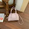 Bolso bowling casual minimalista de estilo coreano, de nicho, con lunares, modelo nuevo 2026, con un toque de alta gama para ir al trabajo, bolso de hombro y cruzado