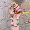 Celebridad de Internet Ins Pulsera de Pulsera de Cuentas de Dibujos Animados Japoneses y Coreanos Linda Cadena de Teléfono Móvil de Té con Leche Llavero Regalo Venta al por Mayor