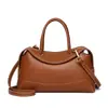 Bolso tipo almohada de alta gama estilo coreano para mujer 2026 Nuevo bolso tote pequeño de alto valor para el trabajo, casual, de nicho, cruzado, de mano