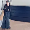 Conjunto de Tres Piezas para Niña Otoño 2026 Estilo Coreano Chaleco Capa Base Pantalones de Pierna Ancha de Lana Chaleco Largo de Punto para Niña