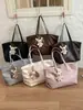 Bolsa tote de cor sólida nicho estilo coreano Shuai Mijia para mulheres, novo modelo 2026, bolsa de mão e bolsa de ombro de grande capacidade na moda para o trabalho
