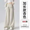 Foto real de pantalones de pierna ancha de nuevo estilo para mujer, verano 2026, de dos piezas falsas con diseño asimétrico, pantalones rectos holgados adelgazantes para un look casual de trabajo