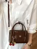 Shuai Mi Jia Bolso Pequeño Cuadrado Portátil Simple y Elegante Verano 2026 Nuevo Bolso de Hombro a la Moda Versión Coreana Bolso Cruzado de Nicho