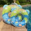 En stock Anillo inflable engrosado para natación infantil Anillo de natación de dinosaurio Anillo de natación de verano colorido Anillo para las axilas Anillo de natación con asa estéreo