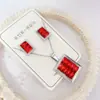 Nuevo especial transfronterizo explosión de tendencia europea y americana titanio acero alta calidad color collar pendientes traje femenino joyería de concha real